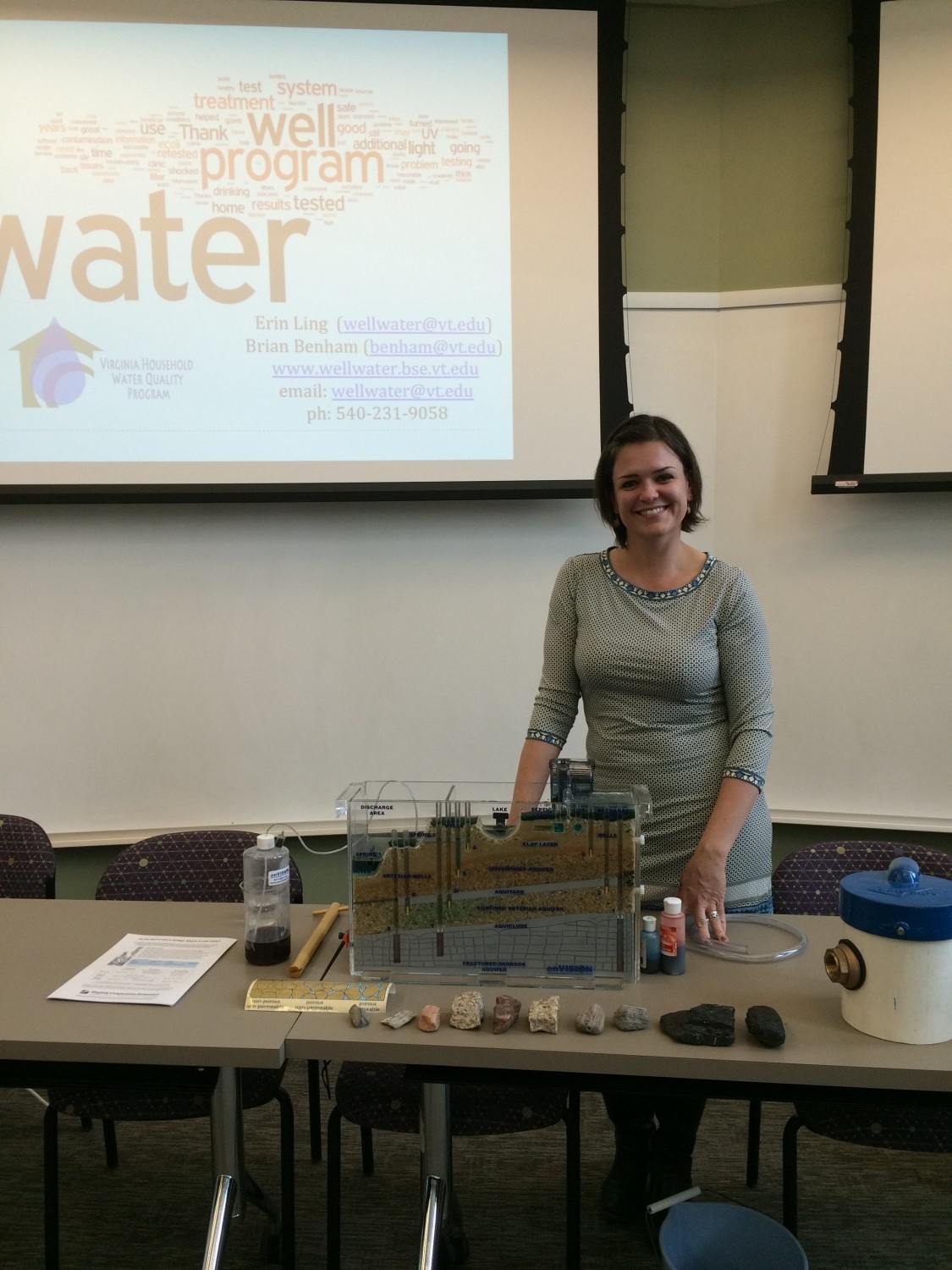 Erin Ling presents a demonstration of groundwater infiltration using a small model