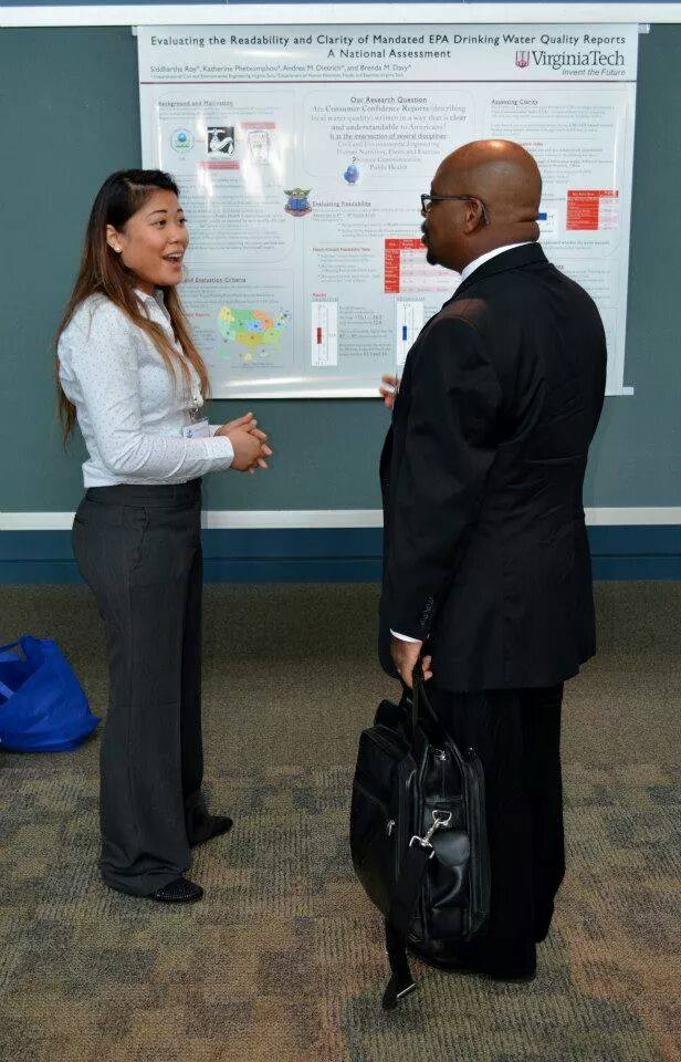 Katherine Phetxumphou presenting her work at a poster session