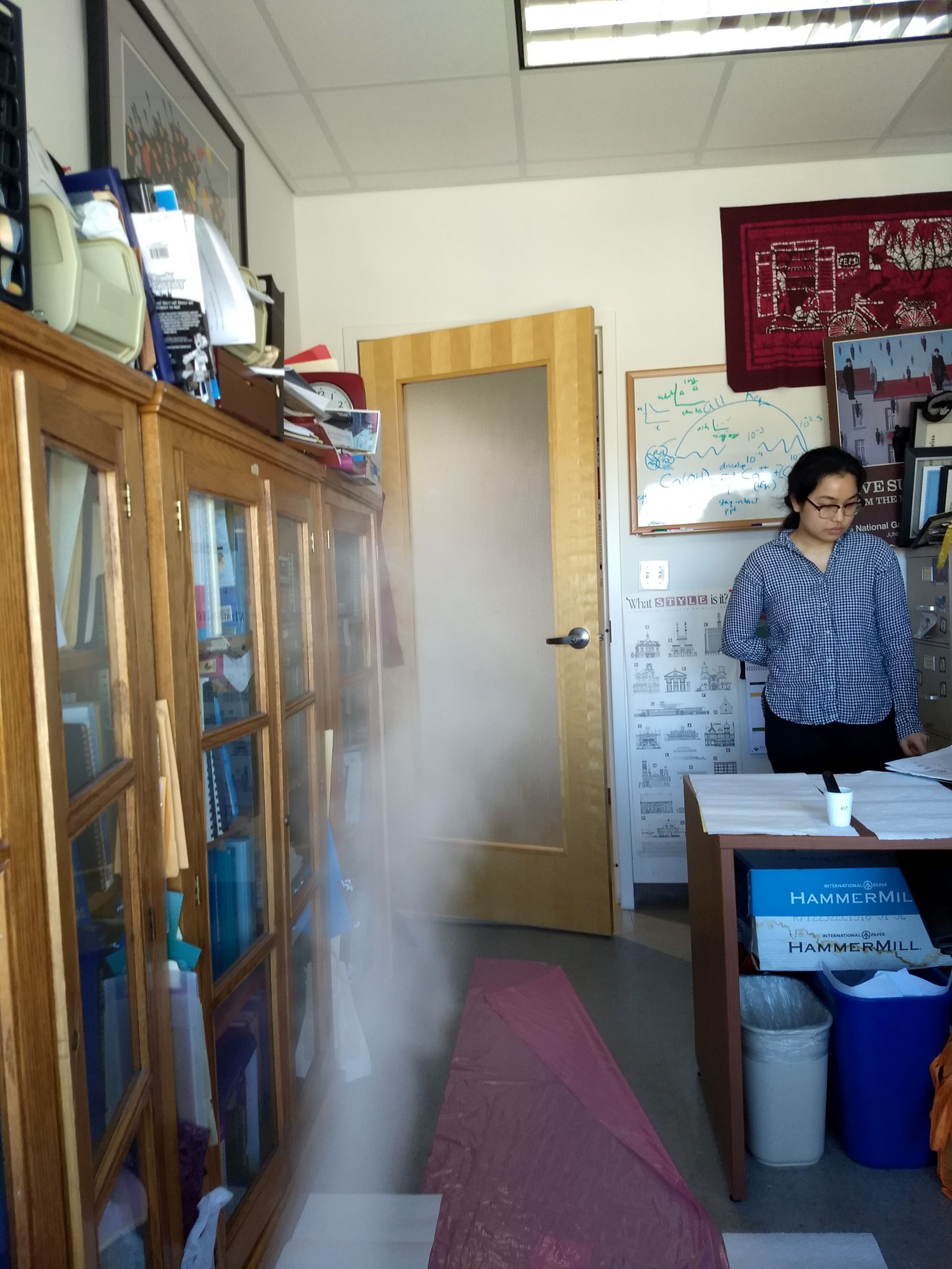 Wenchuo Yao tests the quality of the air in a room with a running humidifier