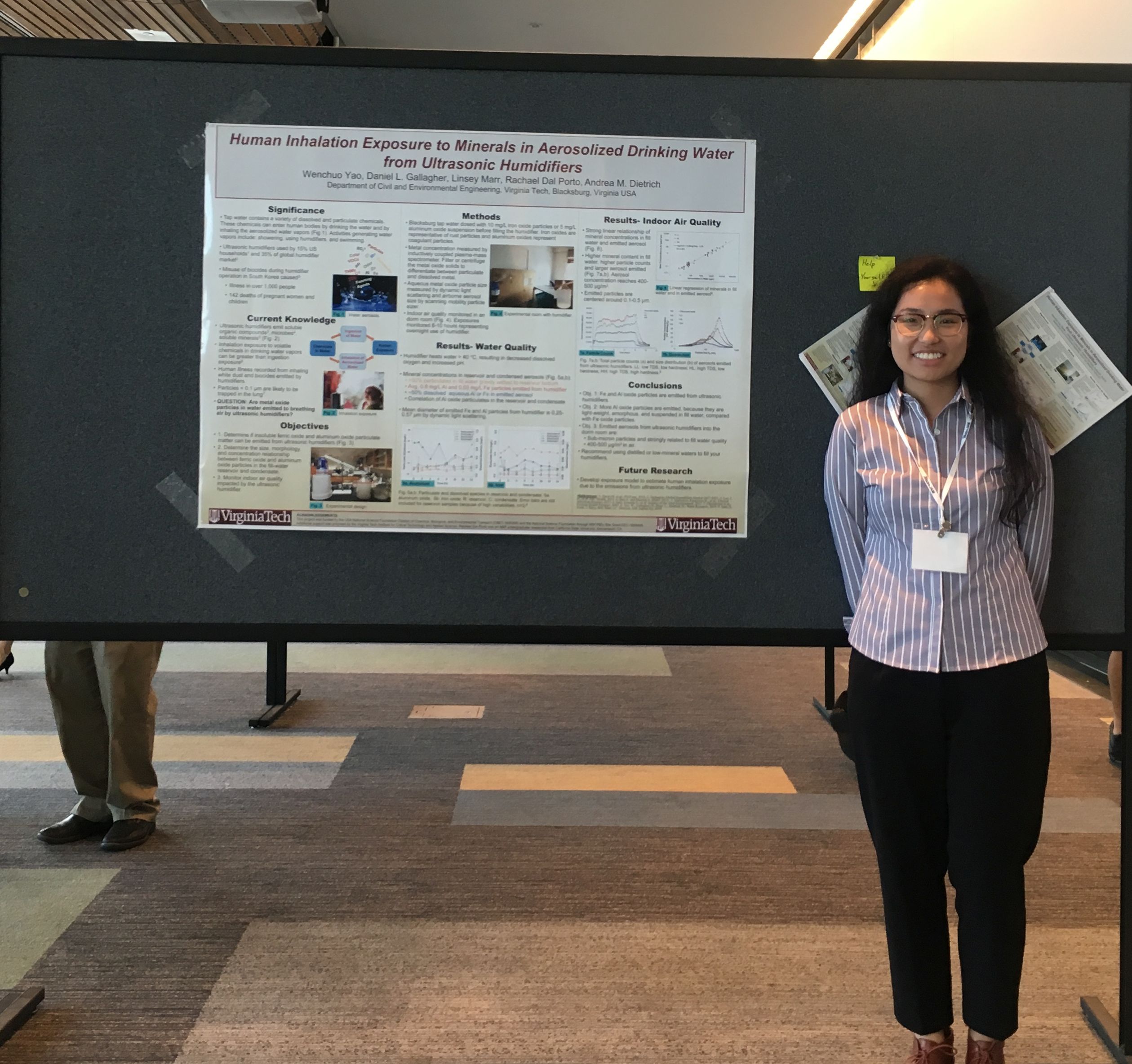 Wenchuo Yao with her poster at a conference