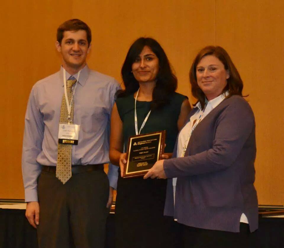 Colin Richards and Nandita Ahuja accept a first-place award at the WaterJam conference in Hampton, VA
