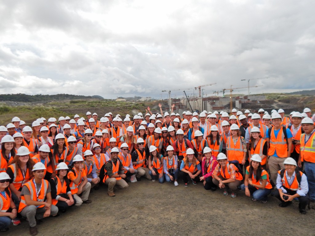A team decked out in orange safety vests and hard hats at the Panama Canal expansion worksite