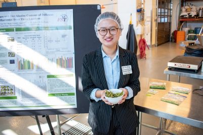 Dajun Yu displaying her edamame research