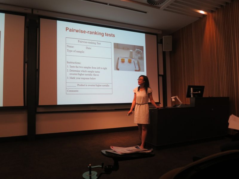 Aili Wang presents at a conference